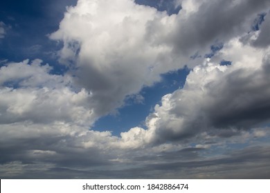 Blue Sky With White And Rainy Clouds On A Sunny Autumn Day