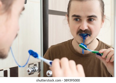 Blue Slobber On Tooth Brush For April Fools Teeth Joke