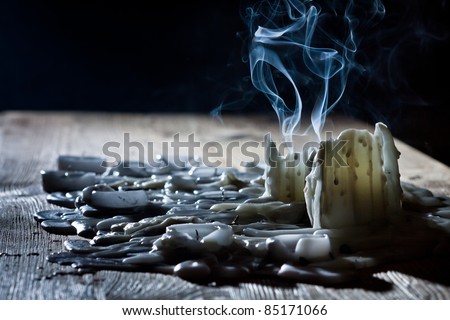Blue smoke with candls on wooden shelf