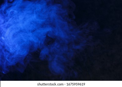 blue smoke on a black background, suitable for advertising a hookah, vape, car smoke, photo shoot or creating a different atmosphere - Shutterstock ID 1675959619