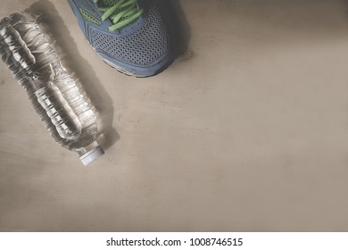 Blue Sneakers And 1 Bottle Of Water. Placed On A Light Brown Wood Floor. Concept: Sports ,Fitness , Running ,Health  And Exercise. Zumba Dance Workout For Weight Loss.