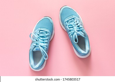 Blue Sneakers Isolated On A Pink Background, Seasonal Shoes For Walking And Sports, Copy Space, Top View