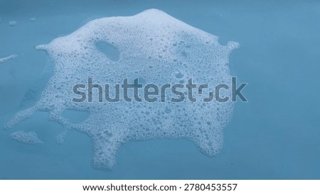 Blue Soap Foam Bubble Texture Background with Soft Cleaning Suds and Abstract Liquid Surface