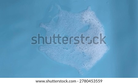 Blue Soap Foam Bubble Texture Background with Soft Cleaning Suds and Abstract Liquid Surface