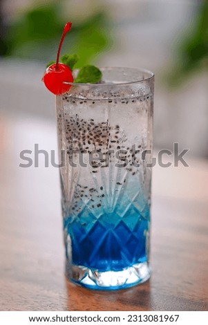Blue Soda Mocktail with Cia Seed Cherry and Mint