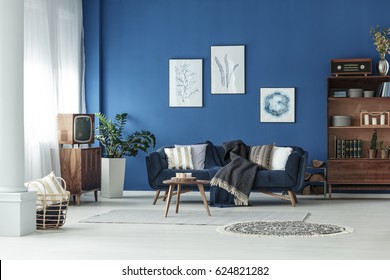 Blue Spacious Room With Wooden Old Fashioned Furniture