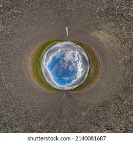 Blue Sphere Little Planet Inside Gravel Road Background. 