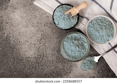 Blue spirulina powder in bowls and spoon on black marble background. Natural vegan superfood. food supplement. place for text. Copy space. - Shutterstock ID 2258688557
