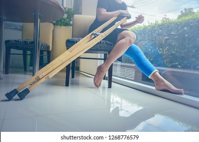 Blue Splint Knee. Bandaged Leg Cast And Toes After A Running Injury Accident.Young Woman In Blue Plaster Cast. Cropped Shot Of A Girl Holding Her Leg In Pain. Shin Splints.