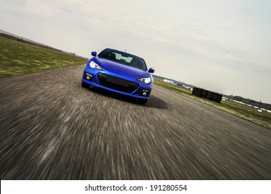 Blue Sport Car On Race Way. Motion Capture.