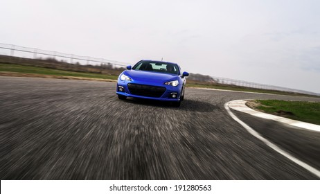 Blue Sport Car On Race Way. Motion Capture.