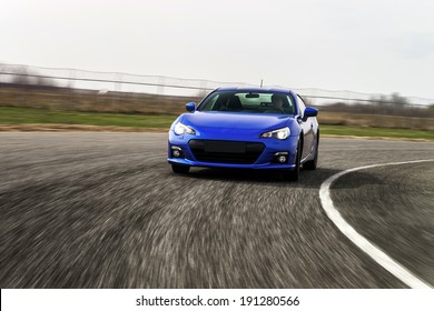 Blue Sport Car On Race Way. Motion Capture.