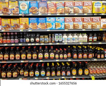 Blue Springs, Missouri / USA - February 20 2020: Shelves Full of Different Kinds of Pancake Mix and Pancake Syrup inside American Supermarket