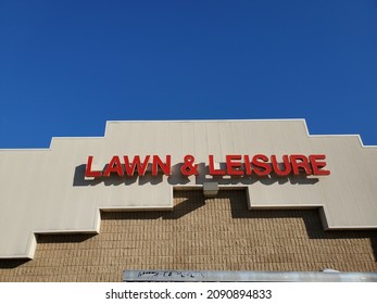 Blue Springs Missouri USA - November 21 2021: Sign On Building Exterior For LAWN And LEISURE Retail Store Beneath Blue Sky