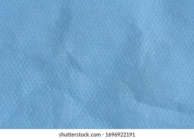 Blue Spunbond Texture Background. Spunbond Is Type Of Nonwoven And Made From Polypropylene. Homemade Virus Pandemic Protection Concept. Close Up Surface Of Spunbond. Medical Face Mask Material