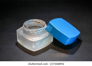 Blue Square Cosmetic Bottle In Low Light Photo Studio Studio