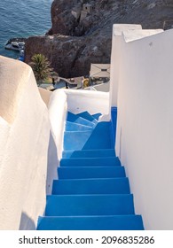 A Blue Staircase Going Down To The Aegean Sea With No People. Taken At The End Of A Sunny Summer Day In The Aegean Island Of Santorini, Greece