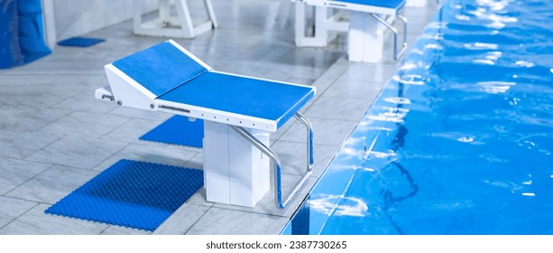 blue starting block in the swimming pool, sport swim kind of sport - Powered by Shutterstock