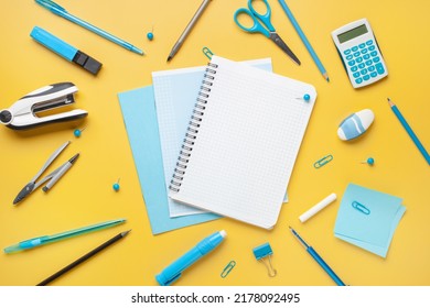 Blue stationery on yellow background. School stationery supplies. Workplace organization. Concept back to school. - Shutterstock ID 2178092495