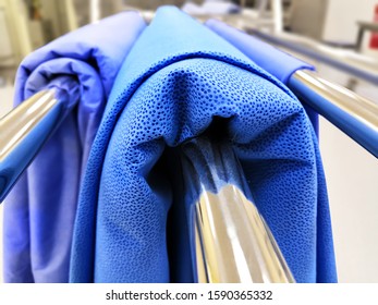 Blue Sterilization Drape Or Wrapping Sheet Hanged On Stand