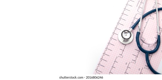 Blue Stethoscope On Electrocardiogram (ECG) Chart Paper. ECG Heart Chart Scan Isolate On White. Healthcare Insurance And Medical Background 