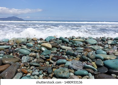 Blue stone and black sand beach