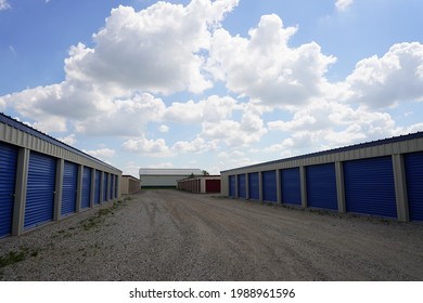 Blue Storage Unit Buildings Site Outside Of Lomira, Wisconsin Holding Owers Property. 