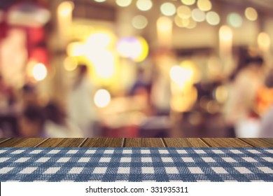 Blue Stripe Table Cloth Cover On Wooden Table And Blurry Beer Garden Background