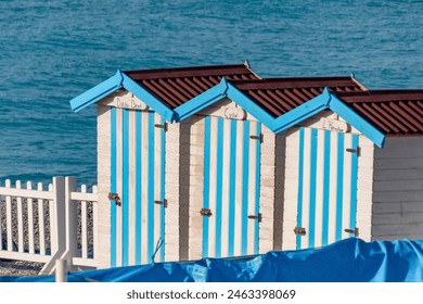 Blue striped changing rooms on beach. Nice, France. - Powered by Shutterstock