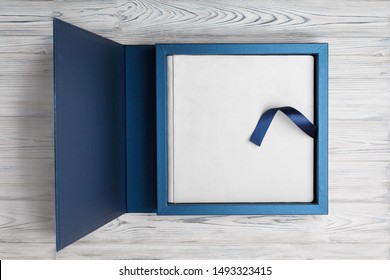 blue stylish square cardboard box for a photoalbum.
Bright original box for white wedding album.
leather family photo book in the open box
blue cardboard box for a photobook - Powered by Shutterstock