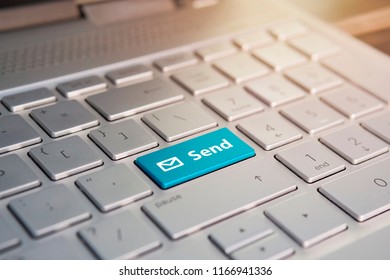 Blue Submit push button on a white keyboard, Color button on the gray silver keyboard of modern ultrabook. caption on the button