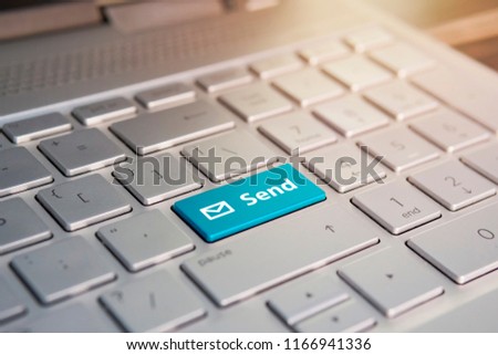 Blue Submit push button on a white keyboard, Color button on the gray silver keyboard of modern ultrabook. caption on the button