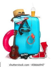 The Blue Suitcase, Sneakers, Hat And Rubber Ring On White Background.