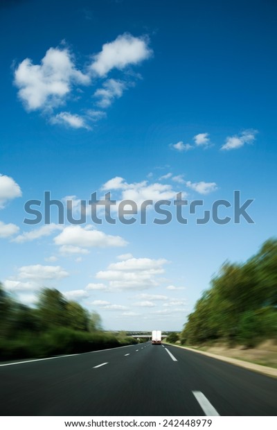 Blue sunny sky\
above highway - southern\
France