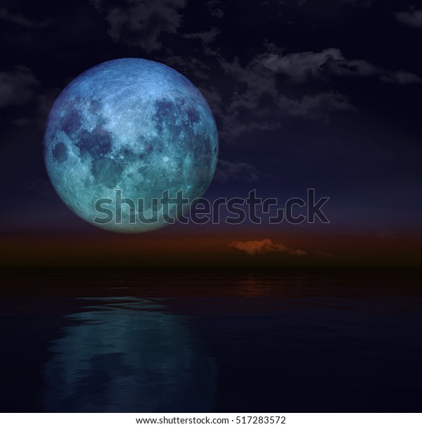 Blue Super moon\
with cloud and reflection.