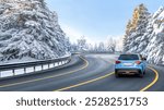 Blue suv car driving on nature road in snowy forest in winter. Snowy winter road landscape in nature trip. Winter travel in mountain road scenery. Winter landscape on the highway in snowy mountains.