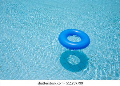 Blue Swim Ring For Children Float On Swimming Pool Isolated