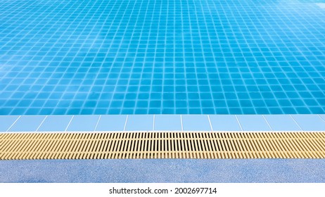 Blue Swimming Pool In Hotel, Holiday Or Summer Style Background, Landscape View Edge Of Swimming Pool.