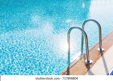 Blue Swimming Pool With Stair At Luxery Hotel