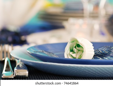 Blue Table Setting For Romantic Dinner With Rose.