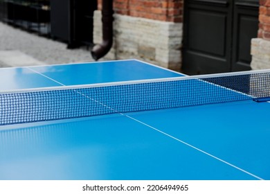 Blue Table Tennis Or Ping Pong. Close-up Ping-pong Net. 