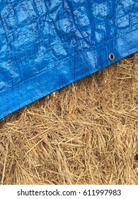 Blue Tarp Covering Hay Bales