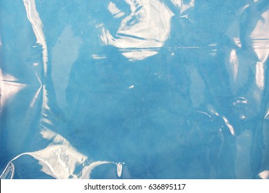 Blue texture of plastic (latex) with reflections and bubbles, similar to the sea texture. Background