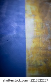 Blue Texture And Yellow. Table Surface. Contrasting Convergence Of Colors. Table In Detail. Scratched Background.