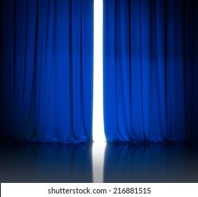 Blue Theater Or Cinema Curtains Slightly Open And White Light Behind