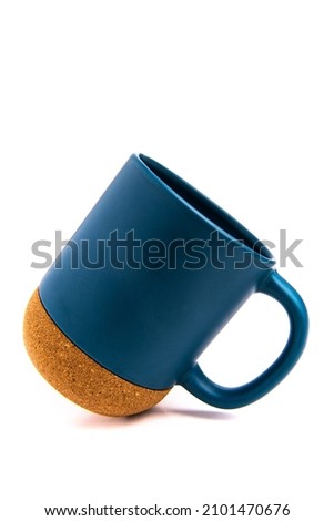 blue thermo mug with a cork bottom on a white background.
