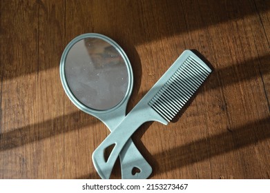 Blue Thin Hair Comb And Blue Hand Mirror