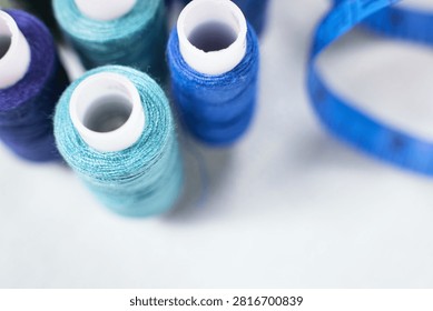 Blue thread spools standing upright, sewing, threads, crafting