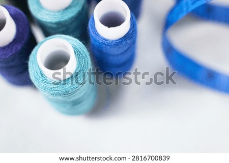 Blue thread spools standing upright, sewing, threads, crafting