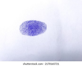 Blue Thumb Impression On White Paper